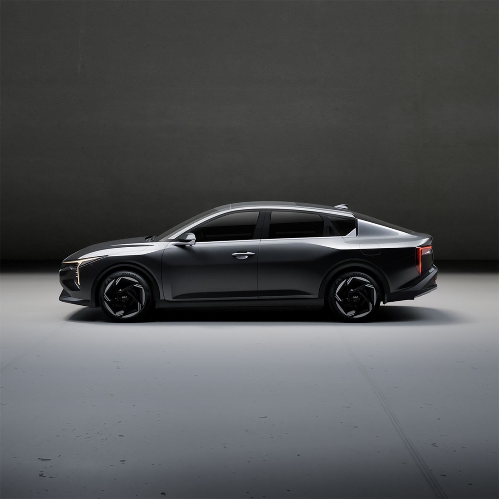 A modern car in a studio — tap a part to add a service