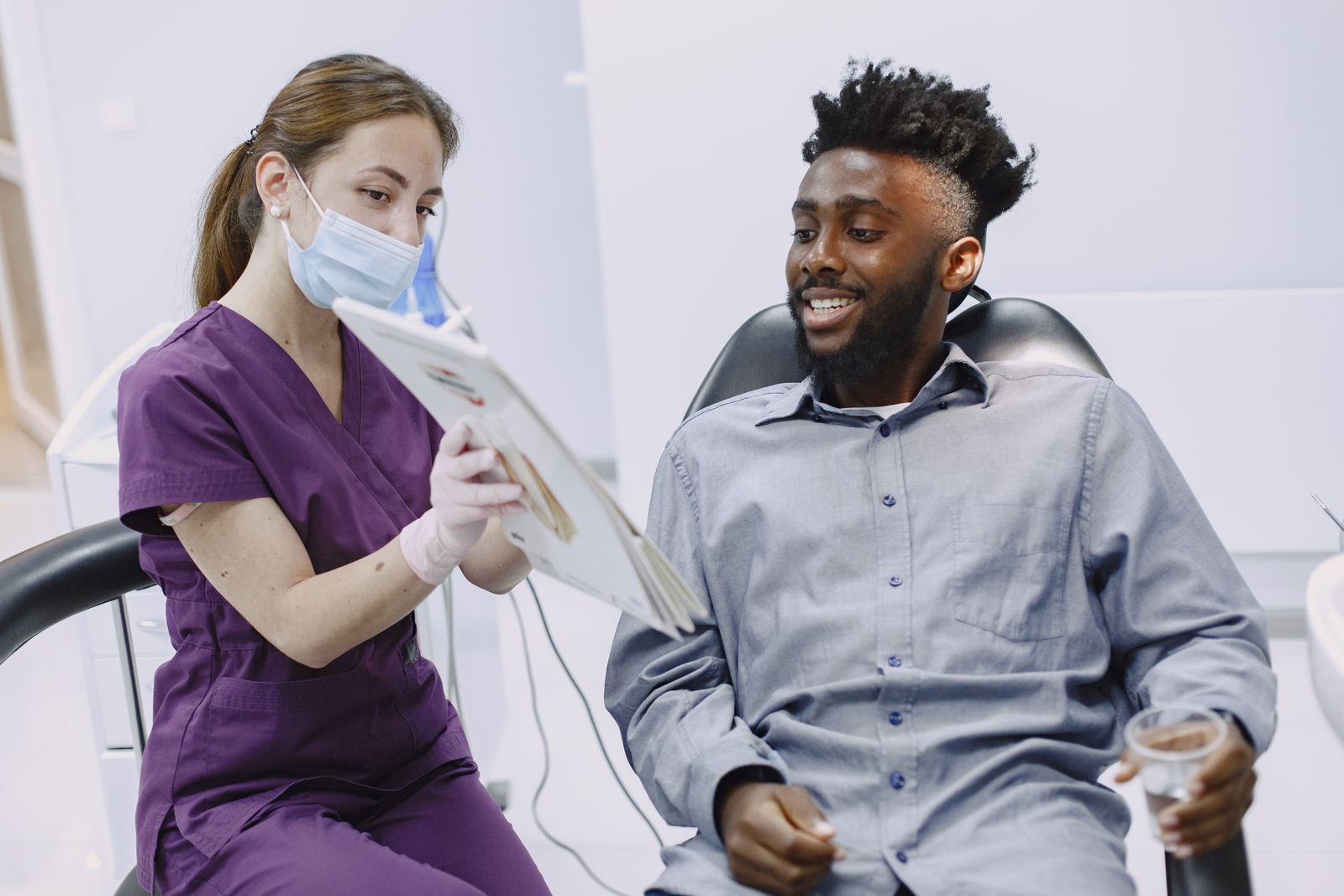 A Marigold Dental team member gently walking a patient through their treatment options