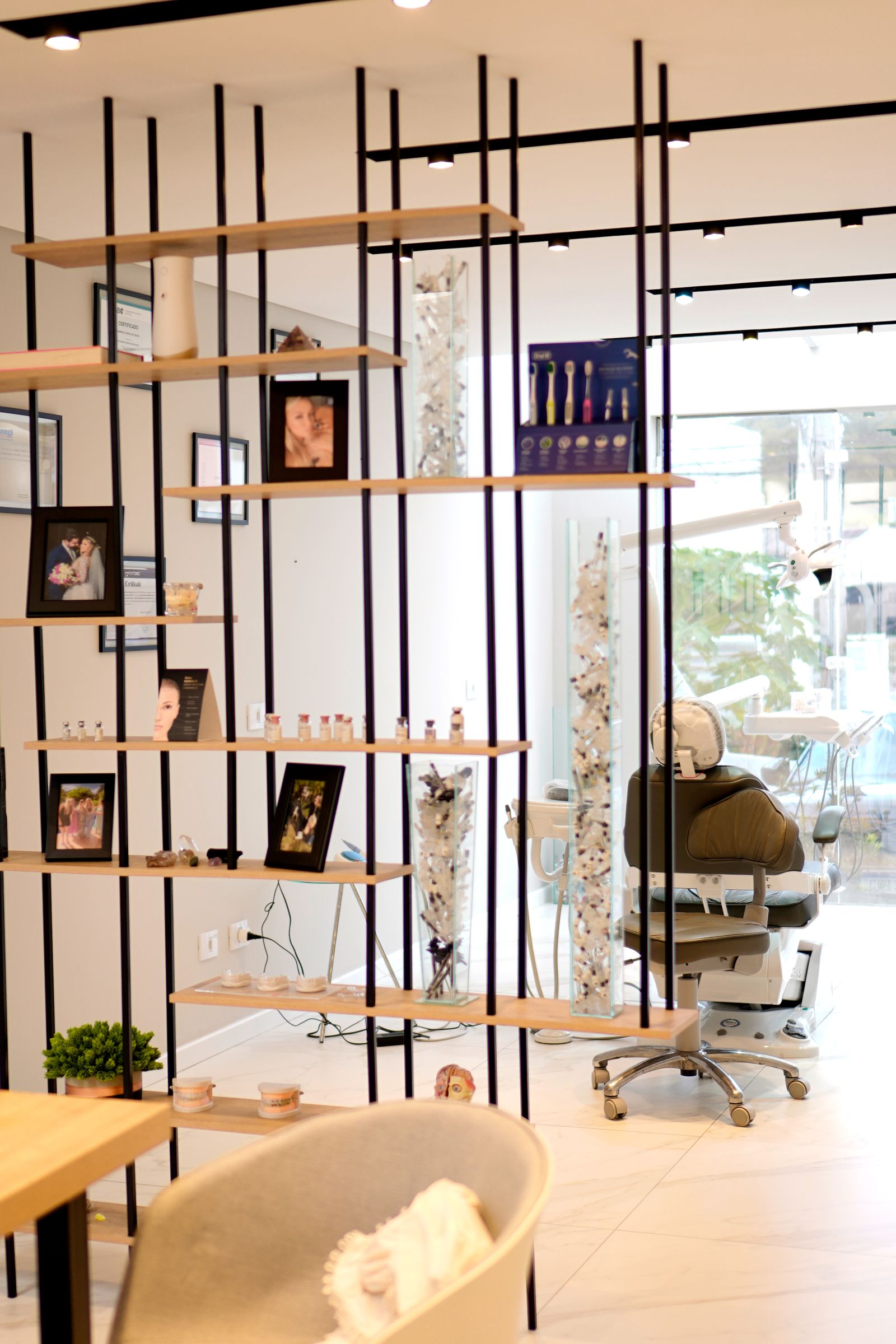 Warm, homey Marigold Dental treatment room with framed photos, plants and natural light