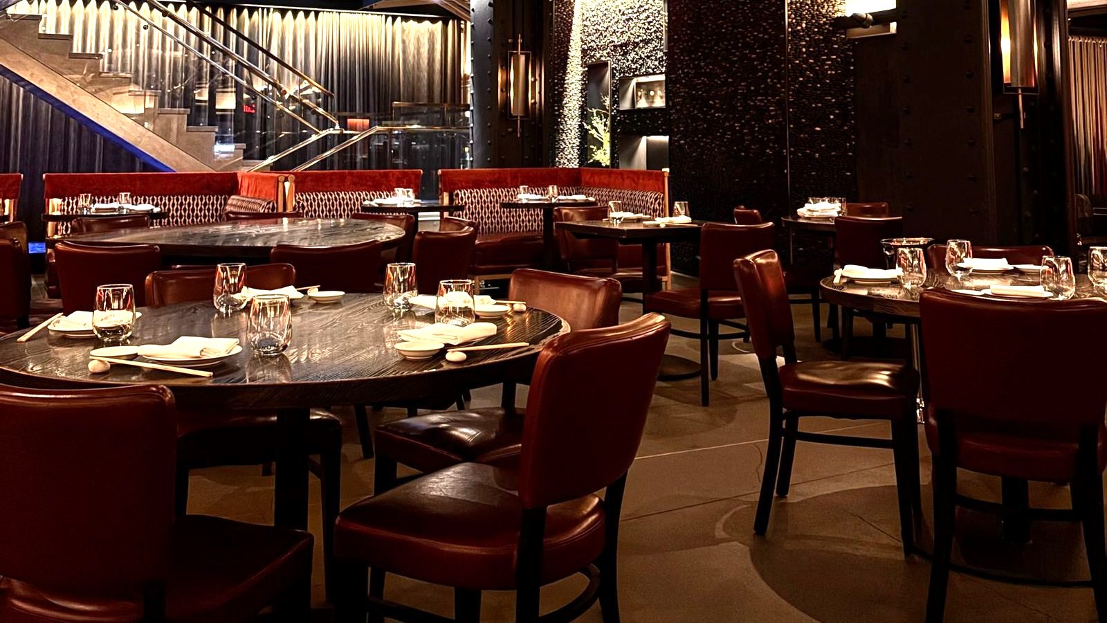 The dining room at Braswell & Co. — leather chairs and low, warm light