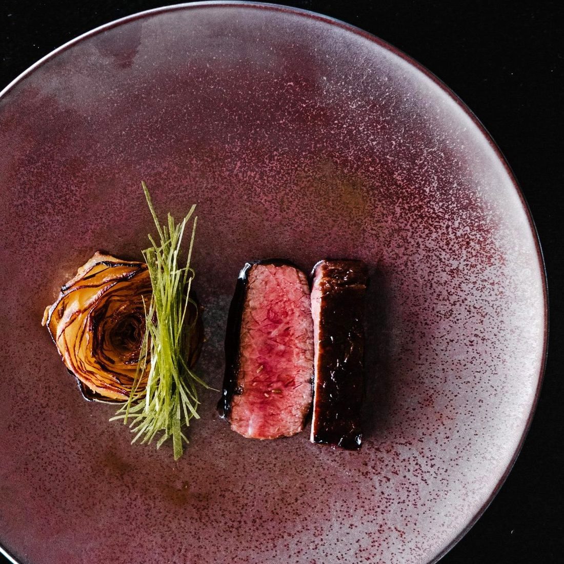 A rested, sliced cut plated simply